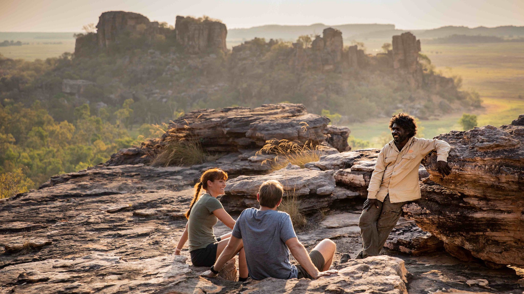 Visitors looking over the Kakadu landscape with an Aboriginal guide from Kakadu Cultural Tours